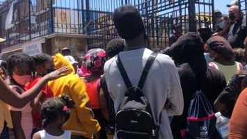 Haitian migrants gather outside a humanitarian project in Ciudad Juárez, MX